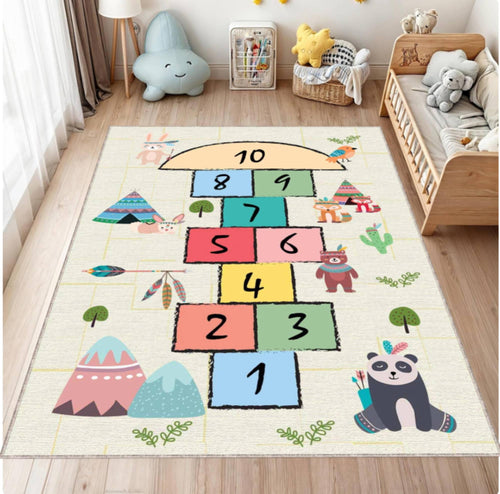 Children's play mat with a colorful hopscotch design in a room with toys and furniture.