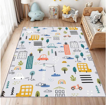 Children's play mat with colorful cityscape design on a wooden floor.