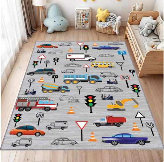 Children's playroom with a colorful rug featuring vehicles and traffic signs.