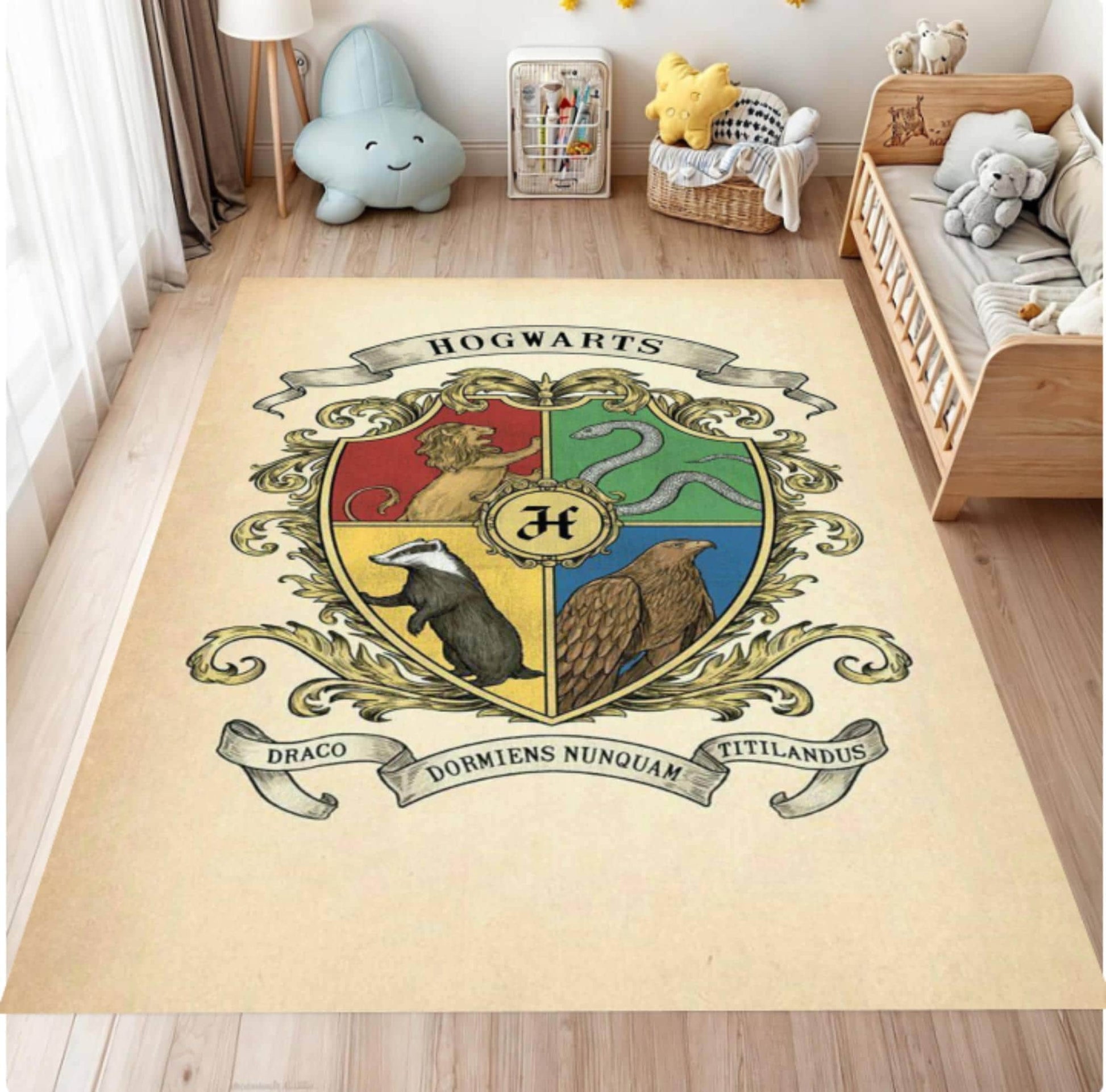 A large cream-colored area rug featuring the Hogwarts crest from Harry Potter, styled in a child's bedroom next to a wooden toddler bed and toys.