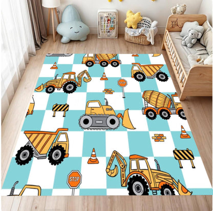Children's room with a checkered rug featuring construction vehicle designs.
