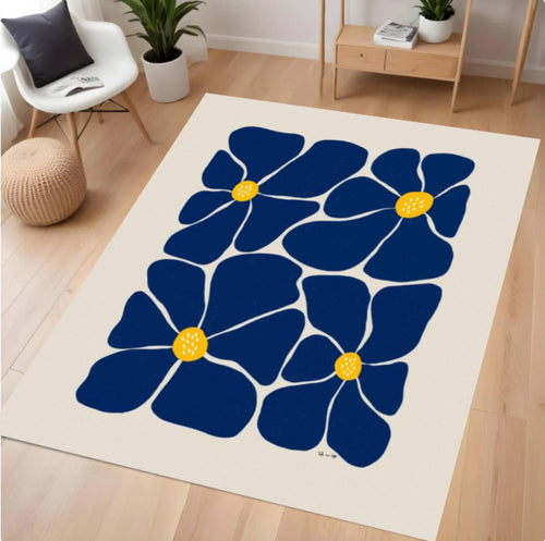 Rug with blue floral design on a wooden floor