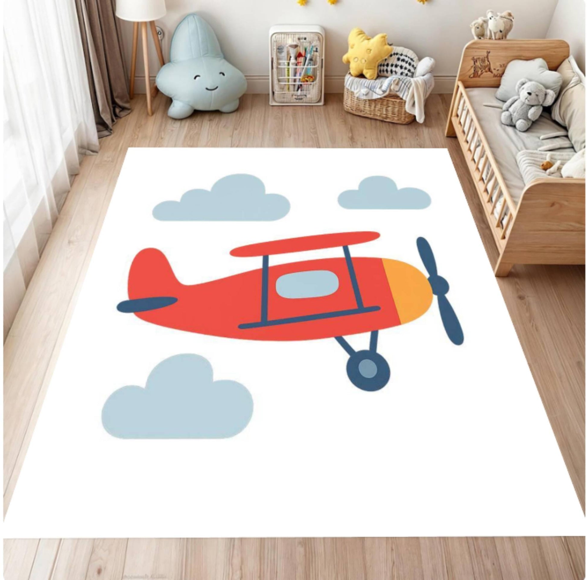 Children's room with a rug featuring an airplane design on a wooden floor.