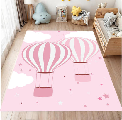 Pink rug with hot air balloon design in a child's room