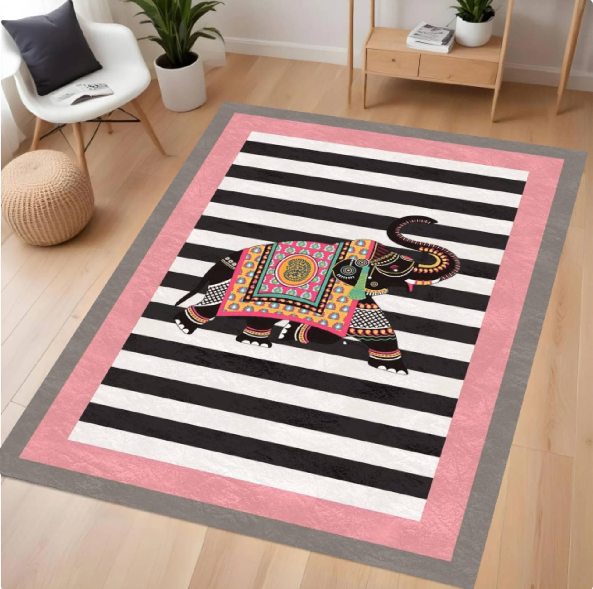 Decorative rug with a colorful elephant design on a black and white striped background, placed in a room with furniture.