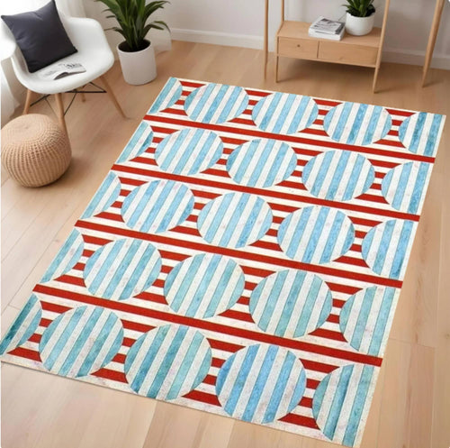 Decorative rug with blue and red pattern on a wooden floor
