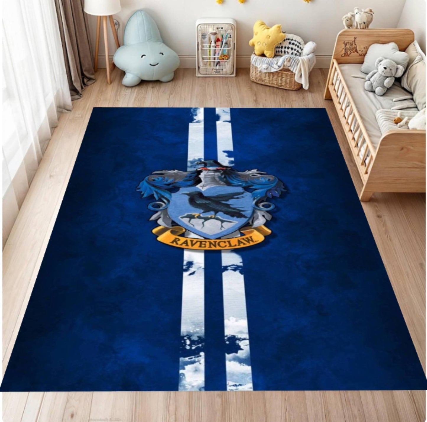 Blue rug with a crest design in a room with toys and furniture