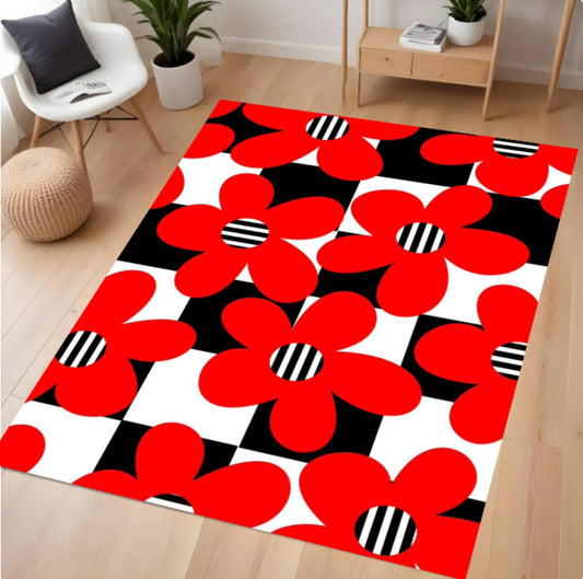Decorative rug with red floral pattern on a wooden floor