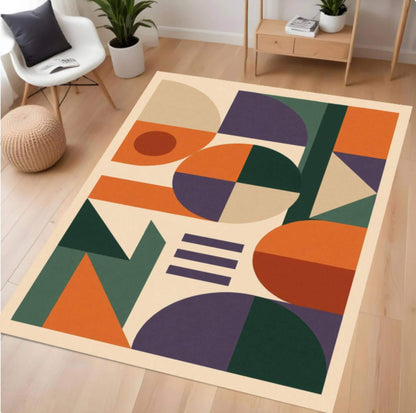 Colorful geometric-patterned rug on a wooden floor with furniture in the background
