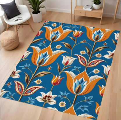 Floral patterned rug on a wooden floor with a chair and plants in the background.