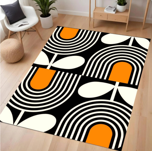 Geometric patterned rug with orange, black, and white design on a wooden floor.