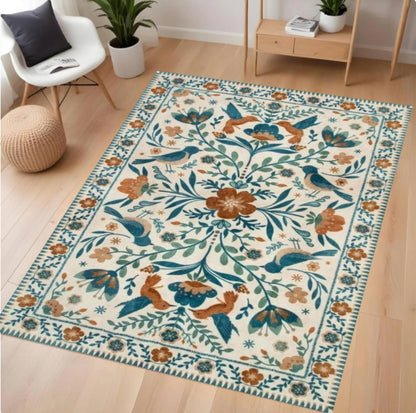 Decorative rug with floral and bird pattern on a wooden floor
