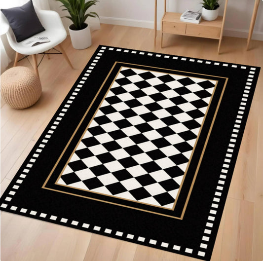 Black and white checkered rug with decorative border on a wooden floor.