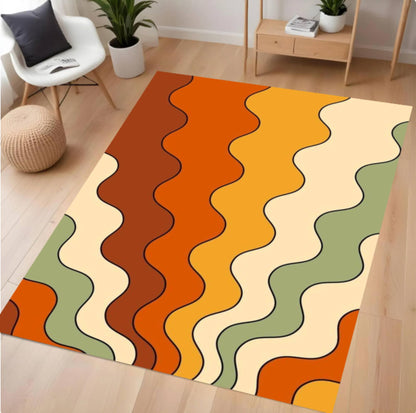 A rectangular area rug with a retro wavy stripe pattern in orange, brown, yellow, cream, and sage green, shown on a light wood floor in a modern living room setting.