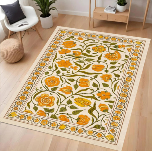 Floral patterned rug on a wooden floor with a chair and plants in the background