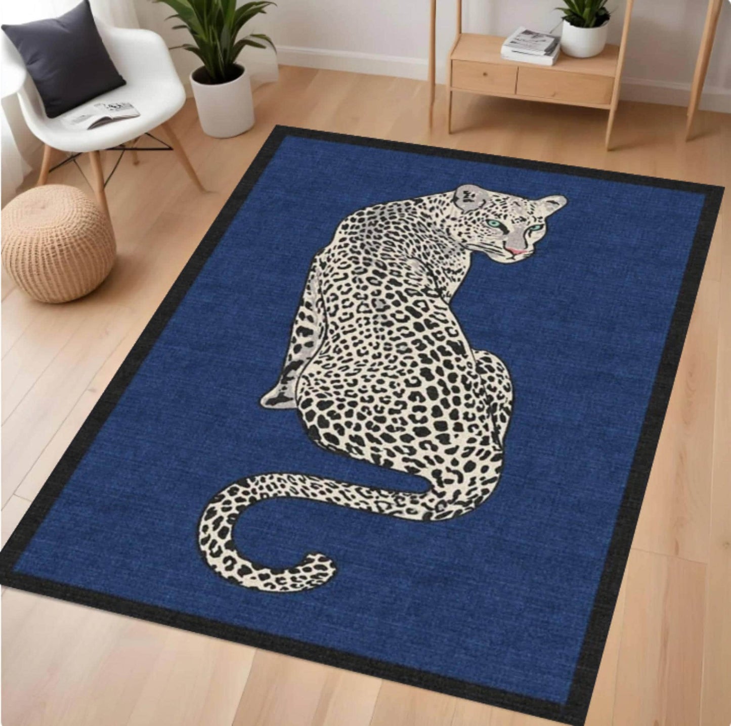 Blue rug with a leopard design on a wooden floor