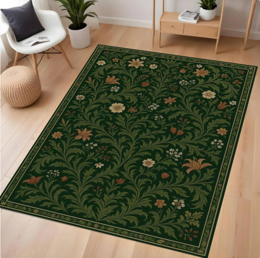 Decorative green floral rug on a wooden floor with a chair and plants in the background.