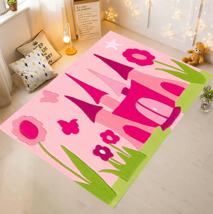 Children's rug with pink castle design on a light wooden floor.