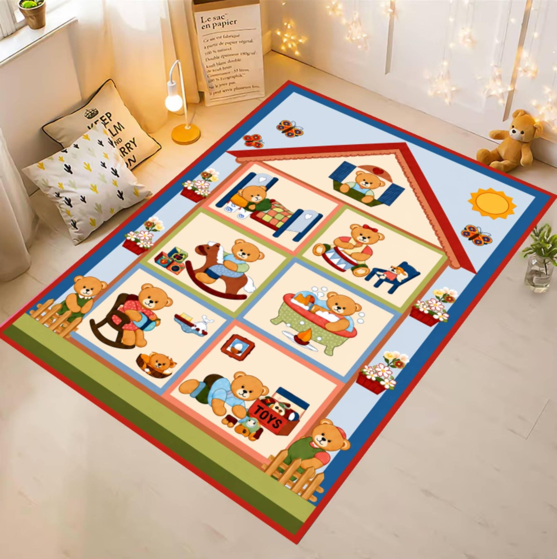 A rectangular nursery rug featuring a house outline and teddy bear illustrations in a nursery room setting.