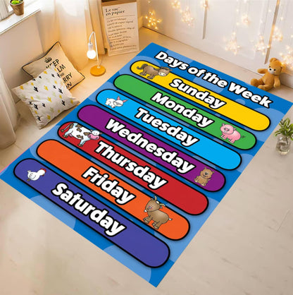 A colorful children's rug laid on a light wood floor in a styled room. The rug shows the days of the week in large rounded color blocks with cartoon animals and white text reading Sunday through Saturday.