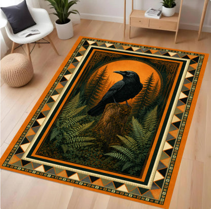 A rectangular area rug with a detailed graphic print of a black raven perched on a tree stump in a dark forest with ferns and an orange circular background, surrounded by a geometric patterned border. The rug is displayed on a light wood floor in a modern living room setting.