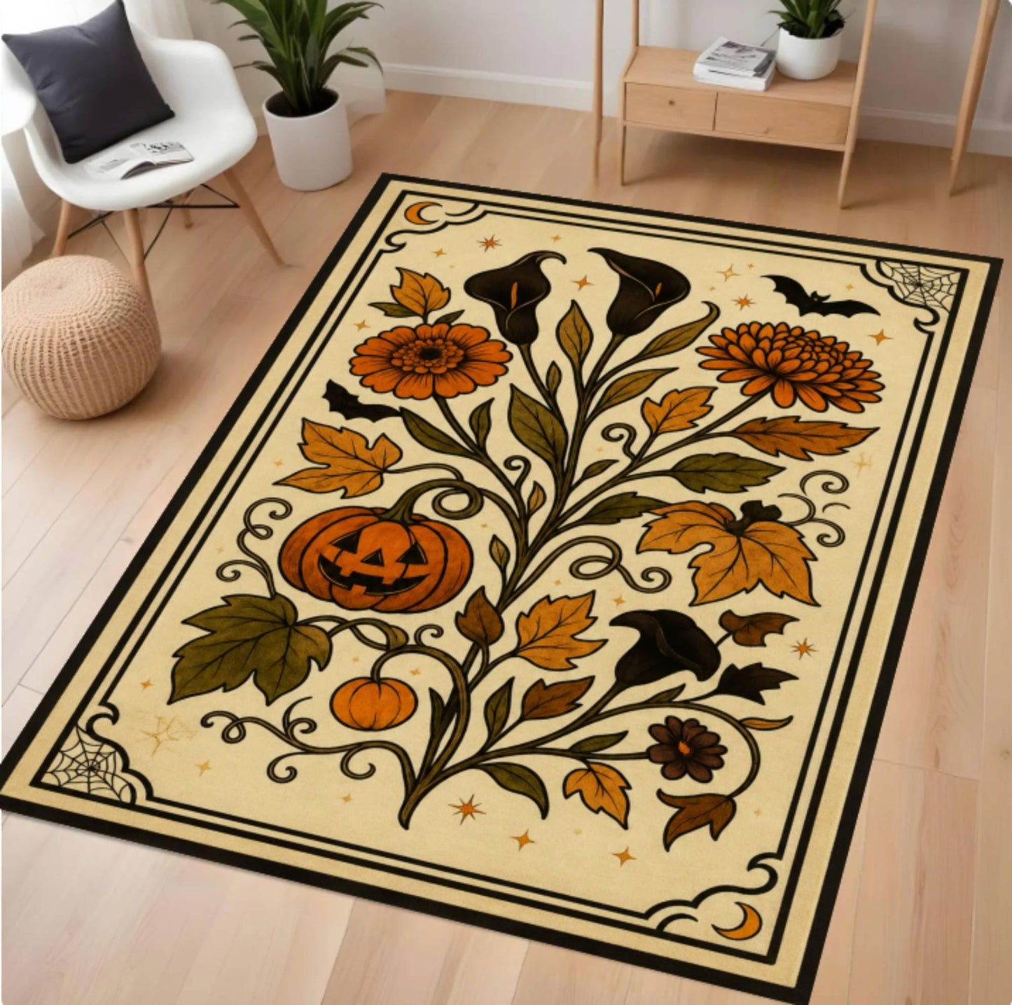 A rectangular area rug with a Halloween floral design, shown in a styled living room setting on a light wood floor. The rug features orange pumpkins, black bats, and black-and-orange flowers with green leaves on a cream background, bordered in black.