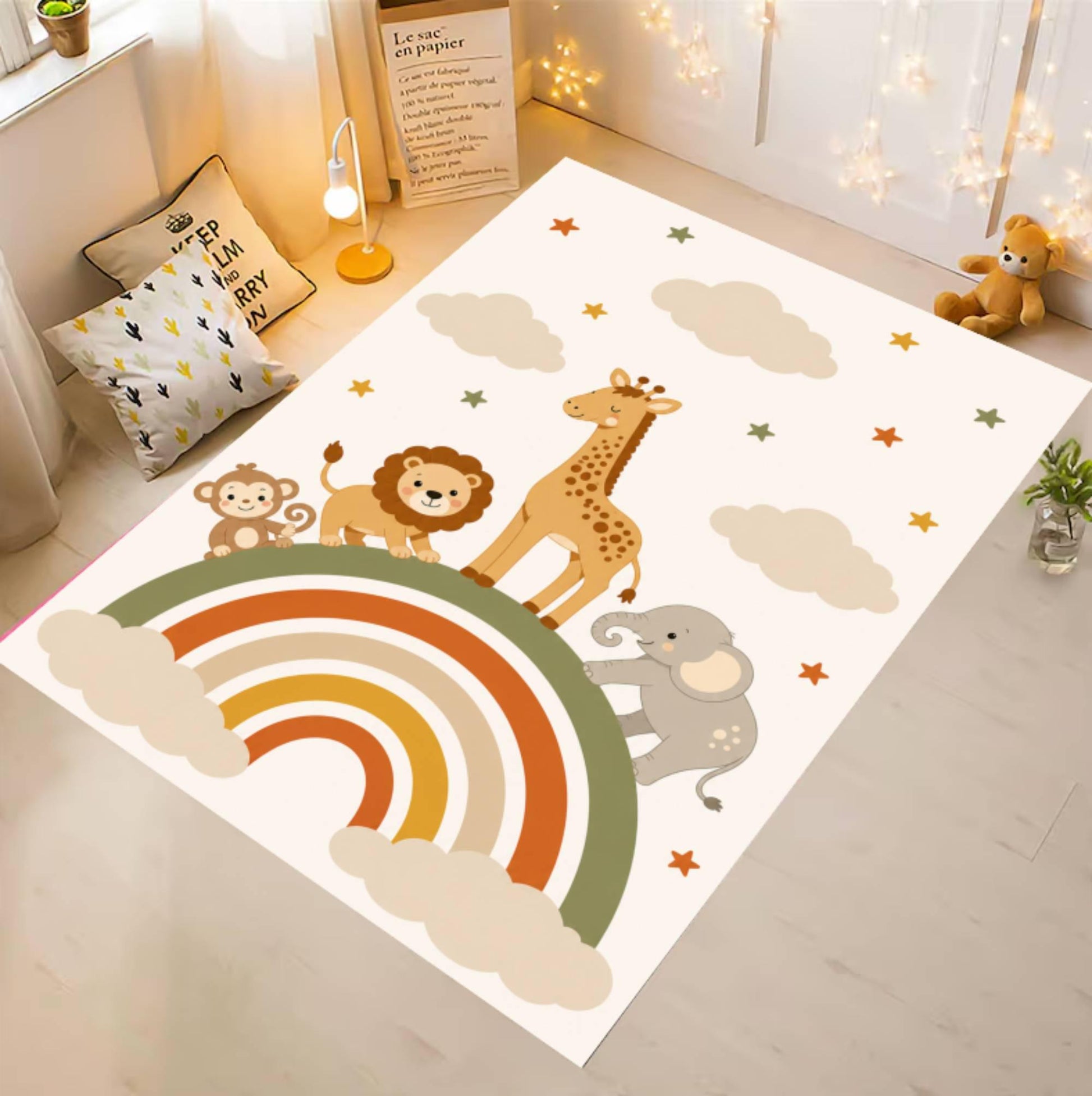 A rectangular children's play rug with a safari animal and rainbow design, shown laid out on a light wood floor in a styled nursery room.