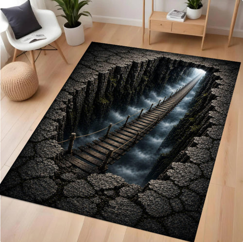 A rectangular area rug with a dramatic 3D-effect print of a wooden bridge spanning a deep chasm, shown on a light wood floor in a modern living room setting.
